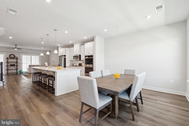 14079 Sunrise Valley Dr Unit 15P, Herndon, VA 20171 - dining space with wood finished floors, ceiling fan, baseboards, and recessed lighting