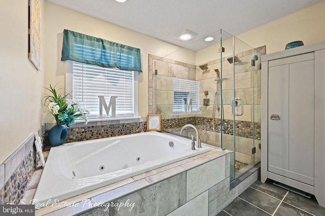 bathroom with tile patterned floors and plus walk in shower