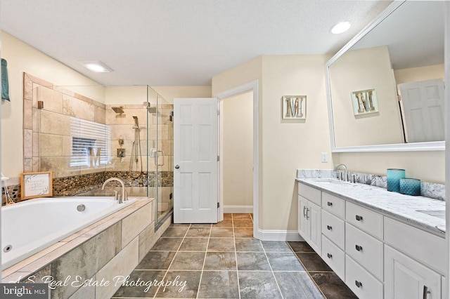 bathroom featuring tile patterned flooring, vanity, and shower with separate bathtub