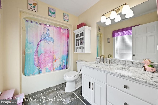 full bathroom with toilet, vanity, tile patterned flooring, and shower / bath combo with shower curtain