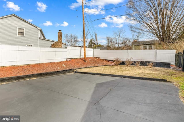 view of yard featuring a patio area and a fenced backyard