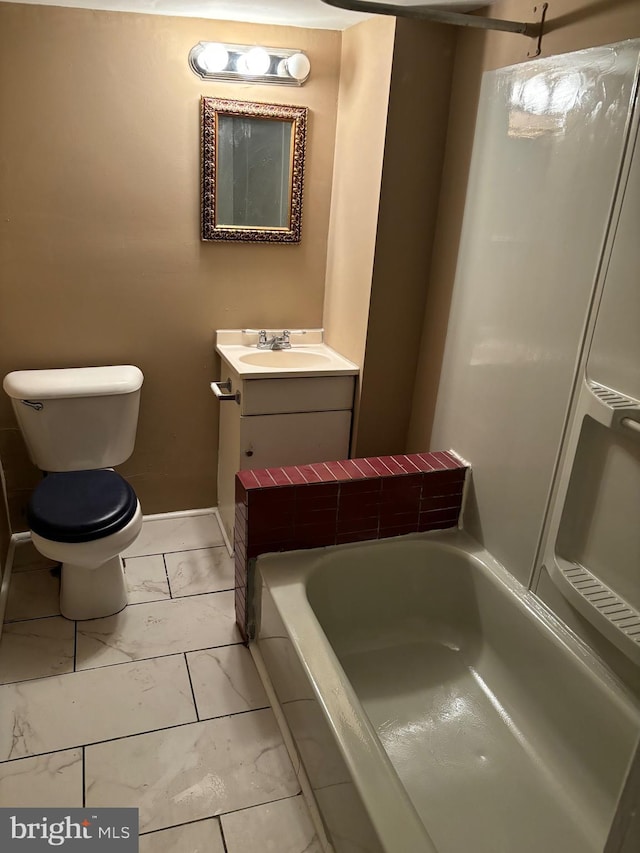 bathroom featuring toilet, vanity, and a bathing tub