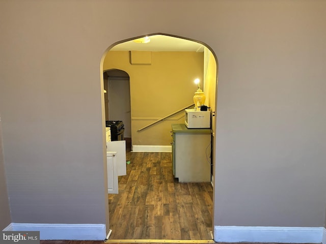 hall featuring dark wood-type flooring