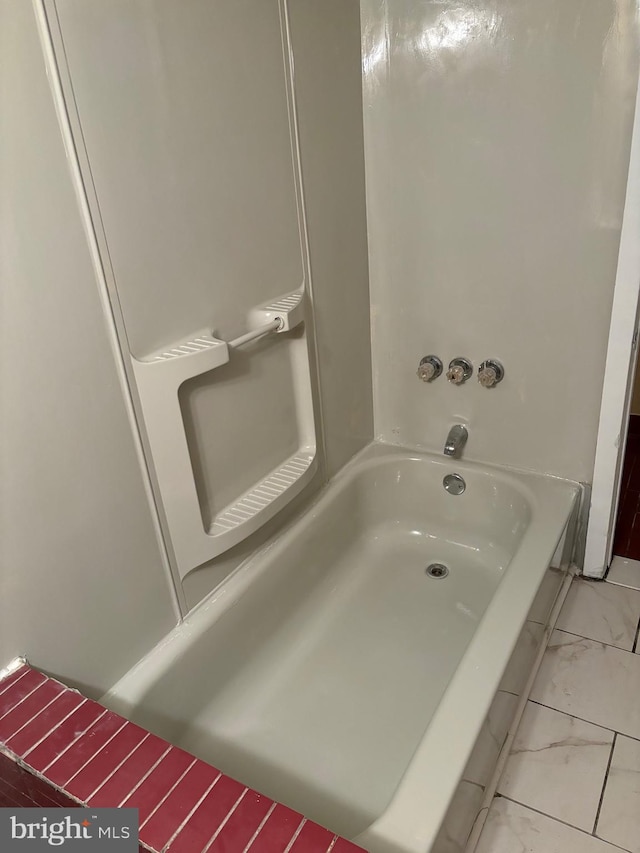 bathroom featuring a tub to relax in