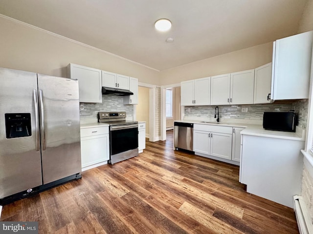 kitchen featuring dark wood-type flooring, sink, white cabinetry, and appliances with stainless steel finishes