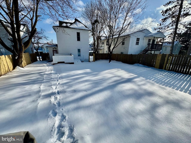 view of yard layered in snow