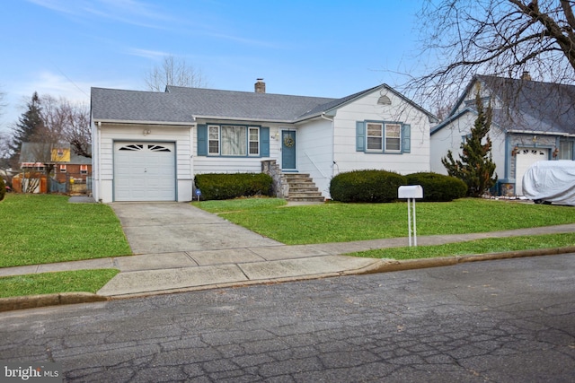 ranch-style house featuring a garage and a front yard