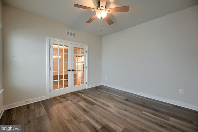 unfurnished room with ceiling fan, hardwood / wood-style floors, and french doors