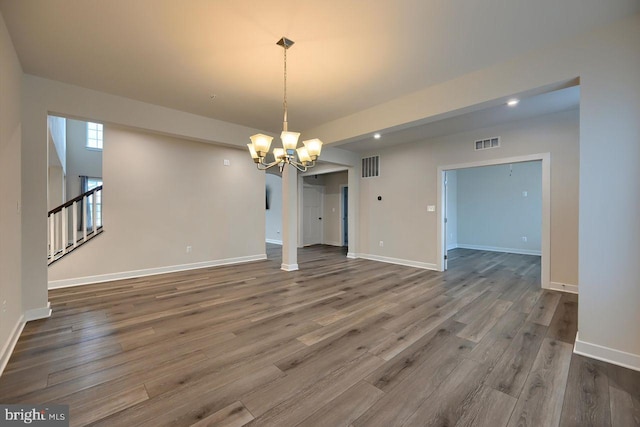 interior space with an inviting chandelier and wood-type flooring