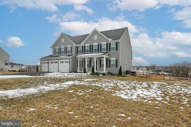 view of front of house featuring central AC and a garage