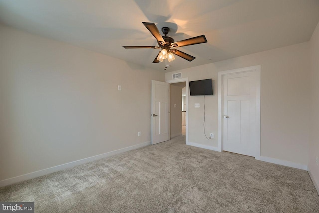 unfurnished bedroom with ceiling fan and carpet flooring