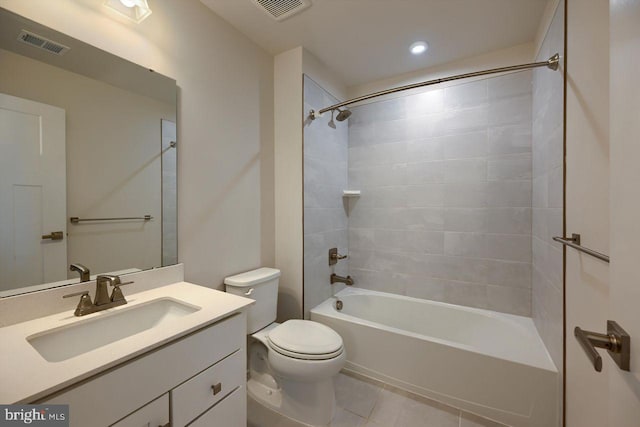 full bathroom with toilet, tile patterned flooring, tiled shower / bath combo, and vanity