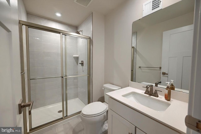 bathroom featuring toilet, vanity, and walk in shower