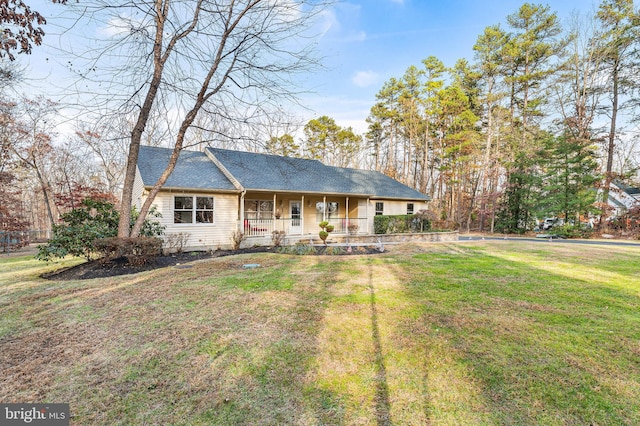 ranch-style house with a front lawn and a porch