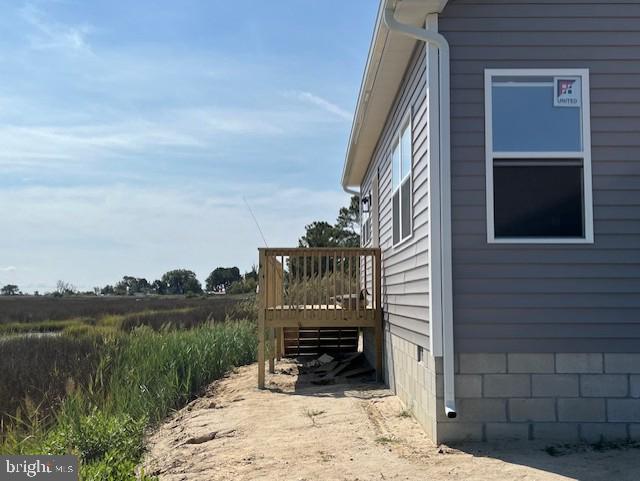 view of home's exterior with a wooden deck