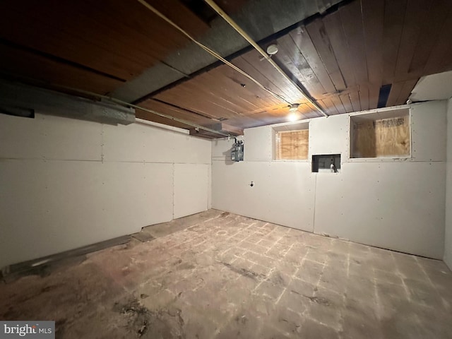 basement featuring wooden ceiling