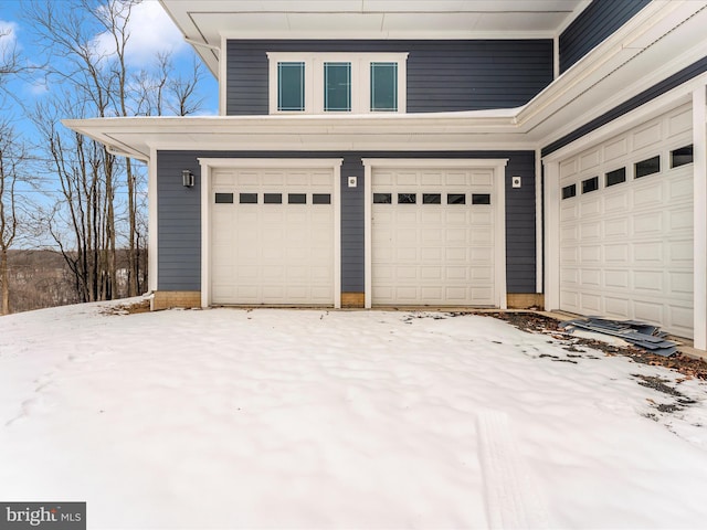 view of snow covered garage