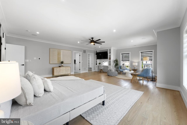 bedroom with crown molding, ceiling fan, and light wood-type flooring