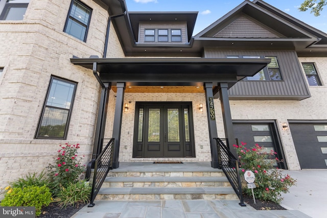 entrance to property featuring a garage