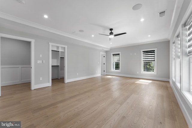 unfurnished living room with crown molding, ceiling fan, and light wood-type flooring