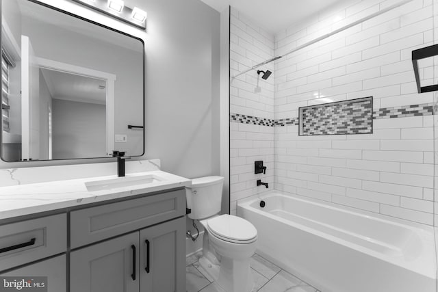 full bathroom with vanity, toilet, and tiled shower / bath