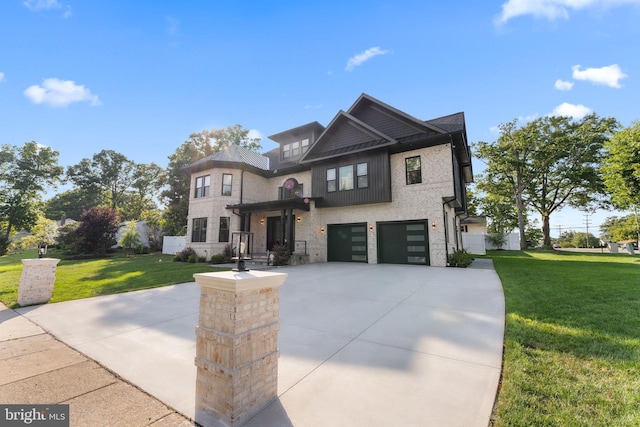 view of front of home with a garage and a front lawn