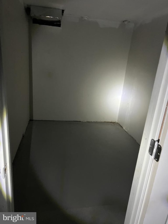 empty room with concrete flooring