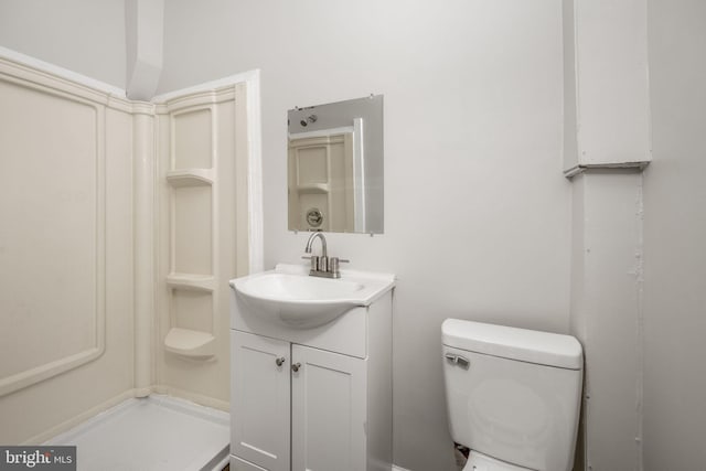 bathroom with toilet and vanity