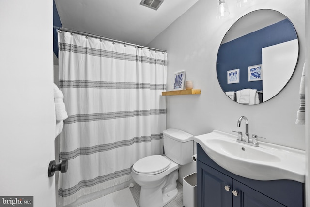 bathroom featuring tile patterned floors, vanity, toilet, and a shower with shower curtain