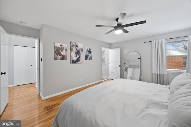 bedroom with ceiling fan and light hardwood / wood-style floors