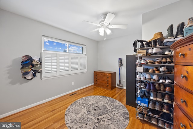 interior space with ceiling fan and hardwood / wood-style floors