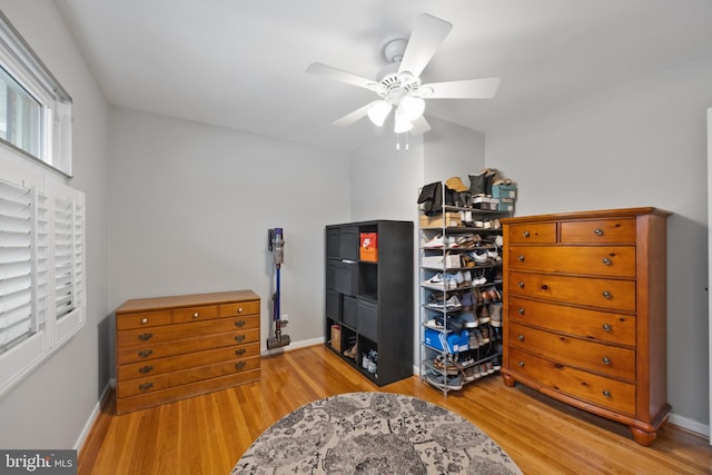 bedroom with ceiling fan and light hardwood / wood-style flooring