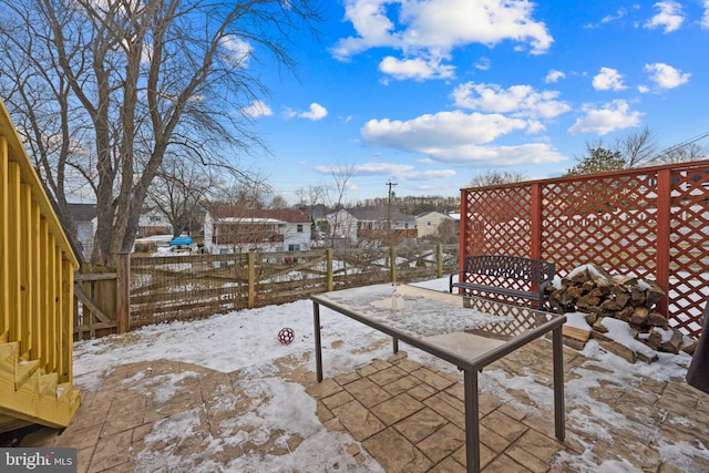 view of snow covered patio