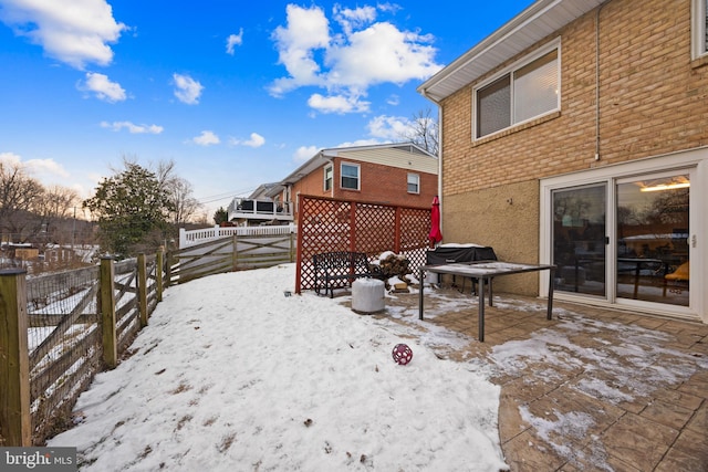 view of yard layered in snow