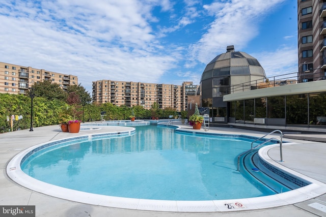 view of swimming pool with a patio