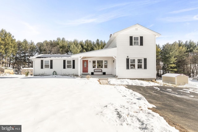 front of property featuring covered porch