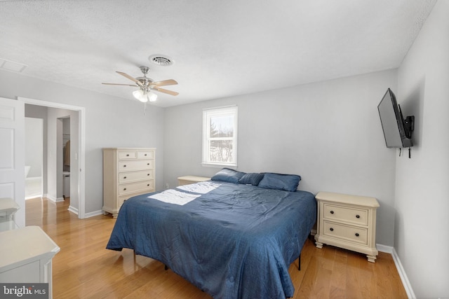 bedroom with ceiling fan and light hardwood / wood-style flooring