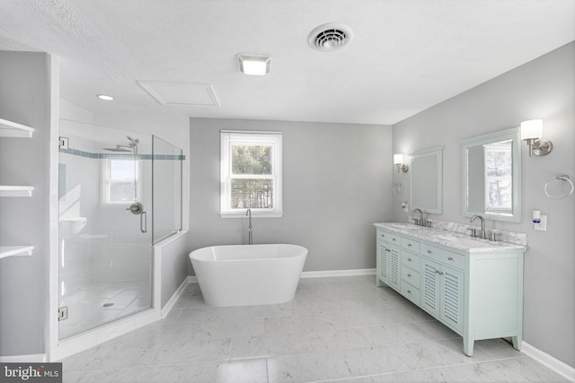 bathroom featuring a textured ceiling, vanity, and plus walk in shower