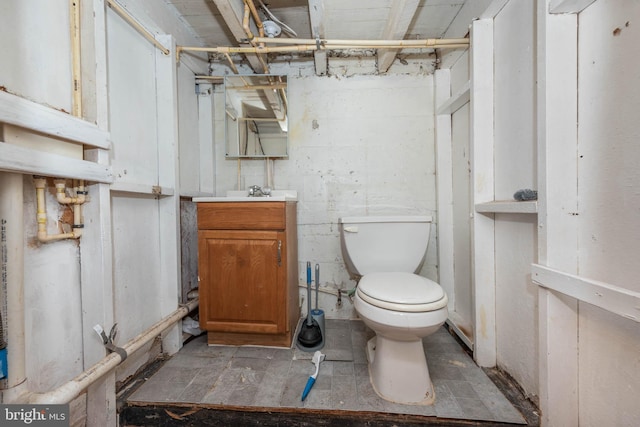 bathroom with toilet and vanity