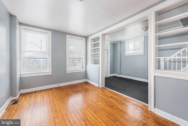 unfurnished bedroom with wood-type flooring