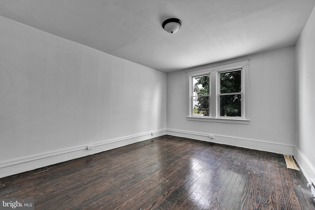 spare room featuring hardwood / wood-style floors