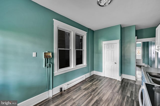 interior space featuring dark wood-type flooring and baseboard heating