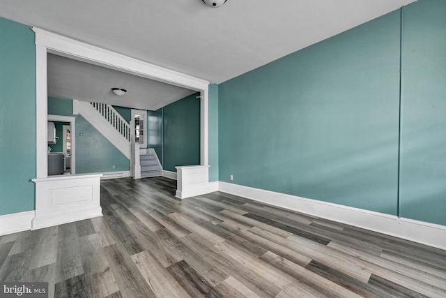 unfurnished living room featuring wood-type flooring