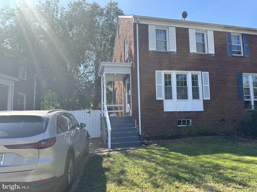 view of home's exterior with a lawn