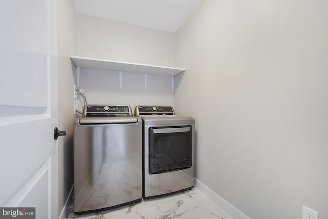 laundry area featuring washing machine and dryer