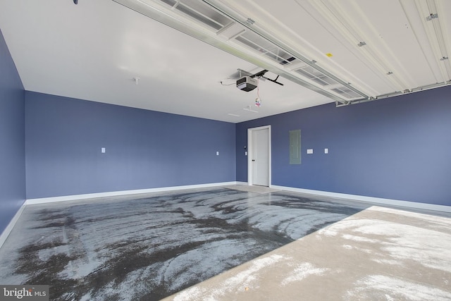 garage featuring a garage door opener and electric panel