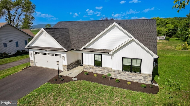 view of front of house featuring a garage and a front yard