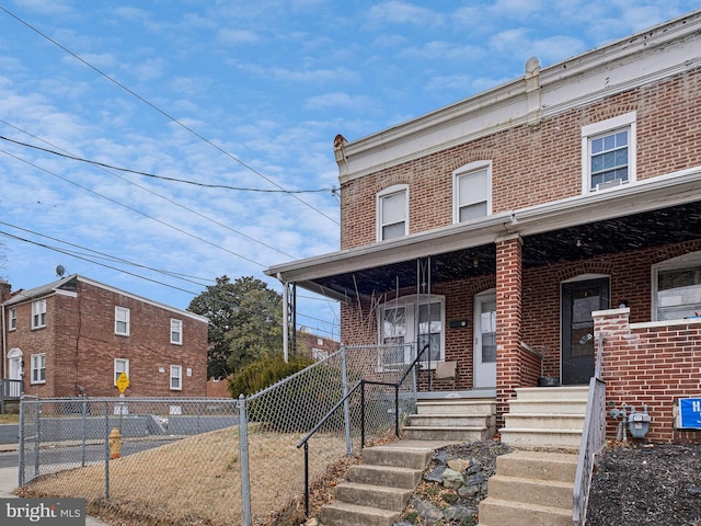 view of property with a porch