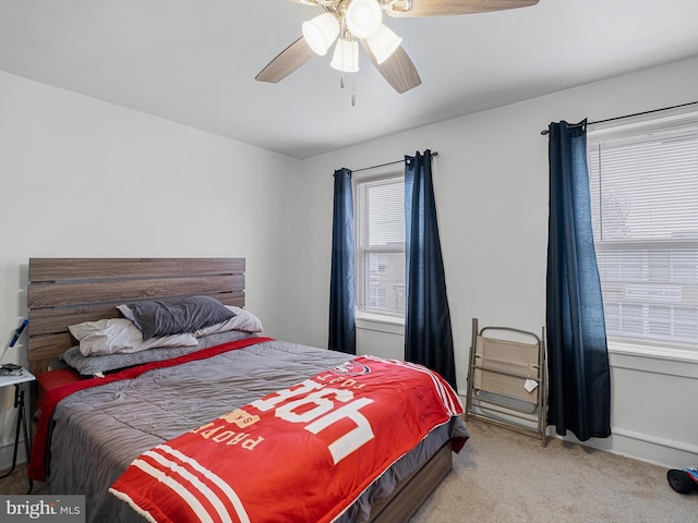 bedroom featuring ceiling fan and light colored carpet