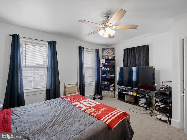 carpeted bedroom with ceiling fan